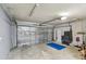 Spacious garage with automatic door, ample storage, and plenty of workspace at 6903 Cedar Ridge N Dr, Pinellas Park, FL 33781