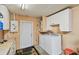 Convenient laundry room with washer, dryer, and ample storage space at 6903 Cedar Ridge N Dr, Pinellas Park, FL 33781