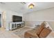 Cozy living room featuring a stylish console and a plush recliner couch at 6903 Cedar Ridge N Dr, Pinellas Park, FL 33781