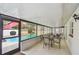 Enclosed patio featuring a view of the pool area and several seating areas at 6903 Cedar Ridge N Dr, Pinellas Park, FL 33781