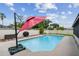 Backyard pool and deck area with updated features and privacy fencing at 6903 Cedar Ridge N Dr, Pinellas Park, FL 33781