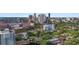 Aerial view of the city showcasing an ideal location surrounded by beautiful buildings and mature trees at 700 Beach Ne Dr # 704, St Petersburg, FL 33701