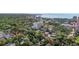 Overhead shot of residential area, with clear views of mature trees, and glimpses of the ocean in the background at 700 Beach Ne Dr # 704, St Petersburg, FL 33701