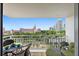 Relax on this balcony with a table and seating, offering city and partial Gulf views at 700 Beach Ne Dr # 704, St Petersburg, FL 33701