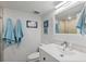 Fresh bathroom with blue towels and a bright vanity, featuring a big mirror at 700 Beach Ne Dr # 704, St Petersburg, FL 33701