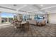 Common room with comfortable seating areas and a balcony showcasing city views at 700 Beach Ne Dr # 704, St Petersburg, FL 33701