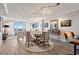 Open-concept dining room with modern lighting and comfortable seating at 700 Beach Ne Dr # 704, St Petersburg, FL 33701