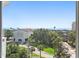 Exterior view of a building with lush landscaping and palm trees at 700 Beach Ne Dr # 704, St Petersburg, FL 33701