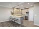 Well-lit kitchen with stainless steel appliances, a mosaic backsplash, and a breakfast bar at 700 Beach Ne Dr # 704, St Petersburg, FL 33701