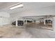 Spacious parking garage with ample lighting, painted pillars, and designated parking spots at 700 Beach Ne Dr # 704, St Petersburg, FL 33701