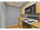 Kitchen offers wooden cabinets and a black microwave, providing plenty of storage space at 7035 Drury St, Tampa, FL 33635