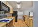 Functional kitchen with butcher block counters, wood cabinets, and modern black appliances at 7035 Drury St, Tampa, FL 33635