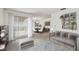 Comfortable living room with large window, modern furniture and decorative shelving at 7035 Drury St, Tampa, FL 33635