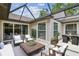 Inviting screened patio with comfortable seating, perfect for outdoor relaxation and entertaining at 7035 Drury St, Tampa, FL 33635