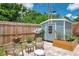 Charming backyard with shed, paver patio, privacy fence and space for relaxing and outdoor activities at 8497 Portulaca Ave, Seminole, FL 33777