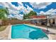 In-ground pool, backyard, outdoor dining area, shed, lounge chairs at 8497 Portulaca Ave, Seminole, FL 33777