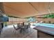 Backyard featuring an in-ground pool and dining area at 8497 Portulaca Ave, Seminole, FL 33777