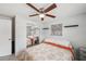 Bedroom with fan, natural light and mirrored closet doors at 8497 Portulaca Ave, Seminole, FL 33777