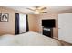 Bedroom featuring a large television and natural light at 8497 Portulaca Ave, Seminole, FL 33777