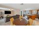 Bright dining area connected to a comfortable living room and an open kitchen, perfect for Gathering gatherings at 8497 Portulaca Ave, Seminole, FL 33777