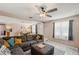 Inviting living room showcases a large sectional sofa, with an adjacent dining area and bright natural light at 8497 Portulaca Ave, Seminole, FL 33777