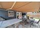 Outdoor dining area featuring a built-in grill and ample room for entertaining at 8497 Portulaca Ave, Seminole, FL 33777