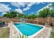 In-ground pool surrounded by a patio and a shed at 8497 Portulaca Ave, Seminole, FL 33777