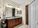 Spacious bathroom with a double sink vanity and walk-in shower at 8562 Acorn Ridge Ct, Tampa, FL 33625
