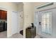 The home's entryway features a decorative glass front door and neutral tones at 8562 Acorn Ridge Ct, Tampa, FL 33625