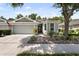 Charming single-story home with a well-manicured yard and inviting curb appeal at 8562 Acorn Ridge Ct, Tampa, FL 33625