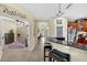 Open and bright hallway adjacent to a breakfast bar with granite countertops at 8562 Acorn Ridge Ct, Tampa, FL 33625