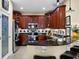 Lovely kitchen with granite countertops, cherry cabinets, and stainless steel appliances at 8562 Acorn Ridge Ct, Tampa, FL 33625