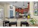 Inviting kitchen with a breakfast bar, cherry cabinets, and stainless steel appliances, perfect for gatherings at 8562 Acorn Ridge Ct, Tampa, FL 33625