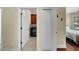 View into the laundry room through an open doorway at 8562 Acorn Ridge Ct, Tampa, FL 33625