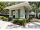 Neighborhood mail kiosk with sturdy pillars and trimmed hedges on a paved walkway at 8562 Acorn Ridge Ct, Tampa, FL 33625