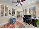 Bright home office featuring plantation shutters and views of the outdoors at 8562 Acorn Ridge Ct, Tampa, FL 33625