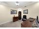 The home office features a sleek executive desk and a neutral color palette at 8562 Acorn Ridge Ct, Tampa, FL 33625