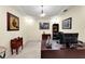 A bright home office features trey ceiling and elegant decor at 8562 Acorn Ridge Ct, Tampa, FL 33625