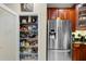 Organized walk-in pantry with adjustable wire shelving provides ample storage space in this well-equipped kitchen at 8562 Acorn Ridge Ct, Tampa, FL 33625