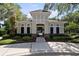 View of a pool house and lush landscaping on a sunny day at 8562 Acorn Ridge Ct, Tampa, FL 33625