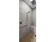 The neutral tiled shower features a built-in bench and sleek chrome hardware at 8562 Acorn Ridge Ct, Tampa, FL 33625