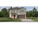 Charming two-story home with a two-car garage and a well-manicured lawn surrounded by trees at 8619 Linked Dr, New Port Richey, FL 34655