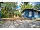 Spacious backyard with lush landscaping and a privacy fence, offering a serene outdoor space at 902 W Columbus Dr, Tampa, FL 33602