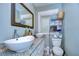 Modern bathroom featuring dual vessel sinks, granite countertops, and ample storage at 902 W Columbus Dr, Tampa, FL 33602