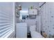 Practical bathroom with a standard toilet, sink, mirror, and coordinated shower curtain at 902 W Columbus Dr, Tampa, FL 33602