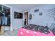 Comfortable bedroom featuring light wood floors, closet, and a view to the hall at 902 W Columbus Dr, Tampa, FL 33602