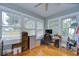 Well-lit bedroom offering large windows and hardwood floors; ideal for a home office at 902 W Columbus Dr, Tampa, FL 33602