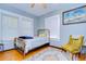 Bright bedroom with large windows and vintage-style decor at 902 W Columbus Dr, Tampa, FL 33602