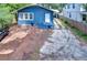 Charming home featuring a classic blue exterior with an entrance and spacious parking area at 902 W Columbus Dr, Tampa, FL 33602