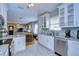 Bright kitchen featuring white cabinetry, granite counters, and stainless steel appliances at 902 W Columbus Dr, Tampa, FL 33602